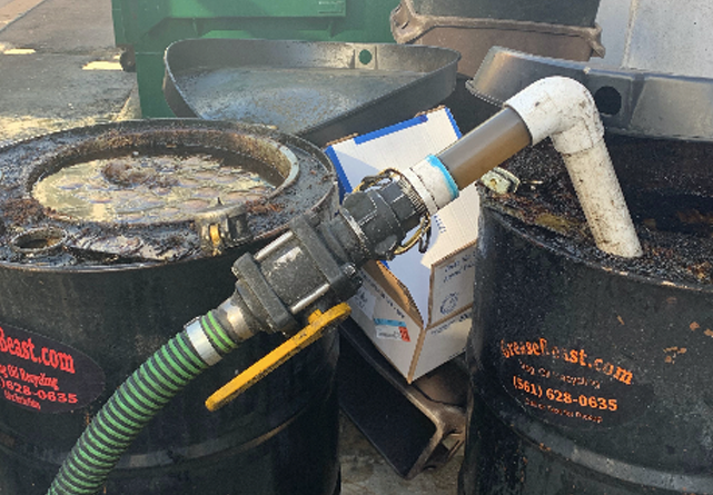 Oil-Collection grease being collected out of containers